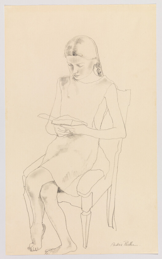 A young girl sits barefoot on a chair reading a small book.