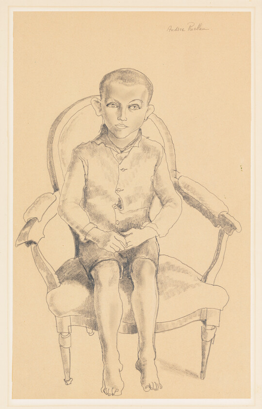 Young barefoot boy sits with folded hands on an upholstered armchair, looking directly ahead.