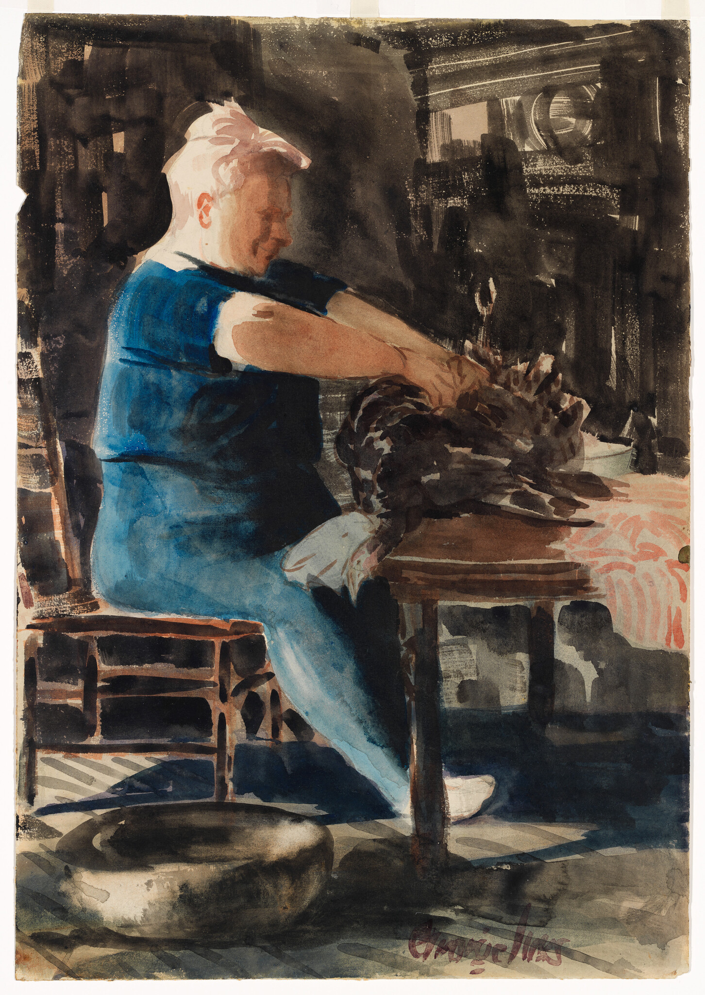 An older woman in a blue dress sits at a table plucking feathers from a large bird.