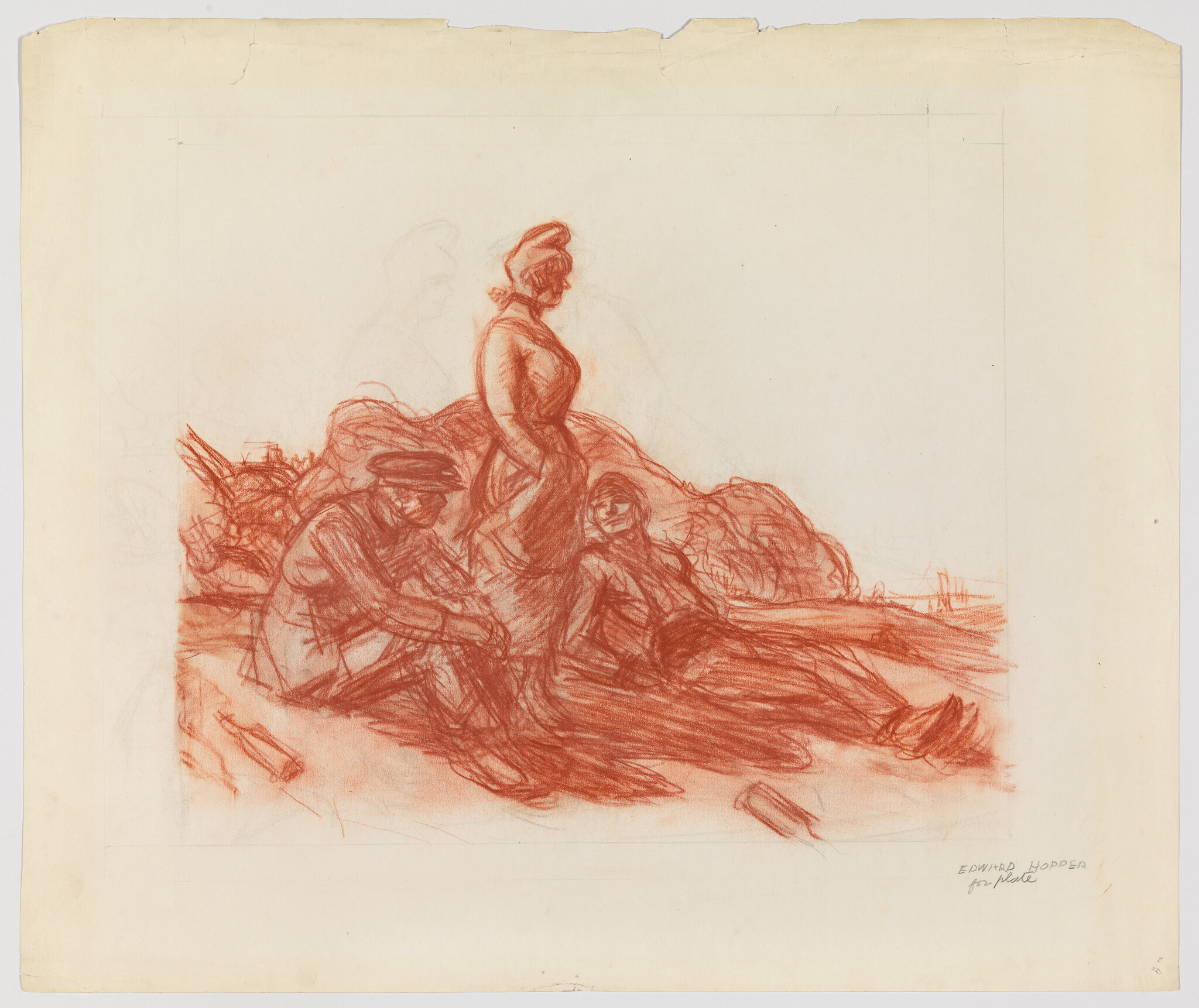 Three people rest on a beach, one woman standing while two others sit and recline.