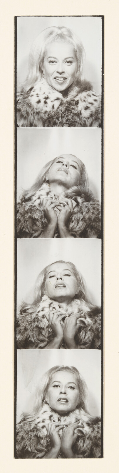 A series of four black and white photobooth strips showing a woman with blonde hair wearing a fur coat. Each strip captures a different expression: the first with a smile, the second with her head tilted back, the third with eyes closed and head back, and the fourth with a direct gaze and a slightly open mouth.