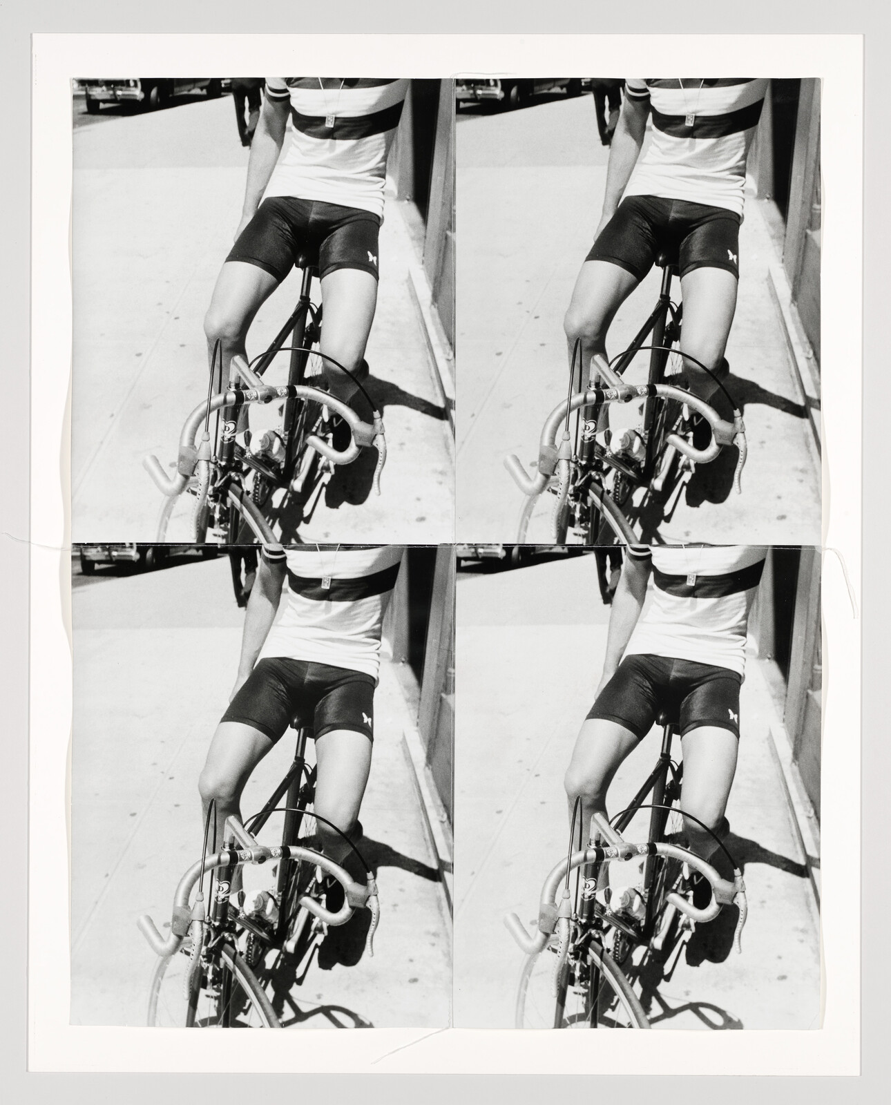 Black and white photo of a person on a bicycle, cropped to show only torso and legs, duplicated side by side.
