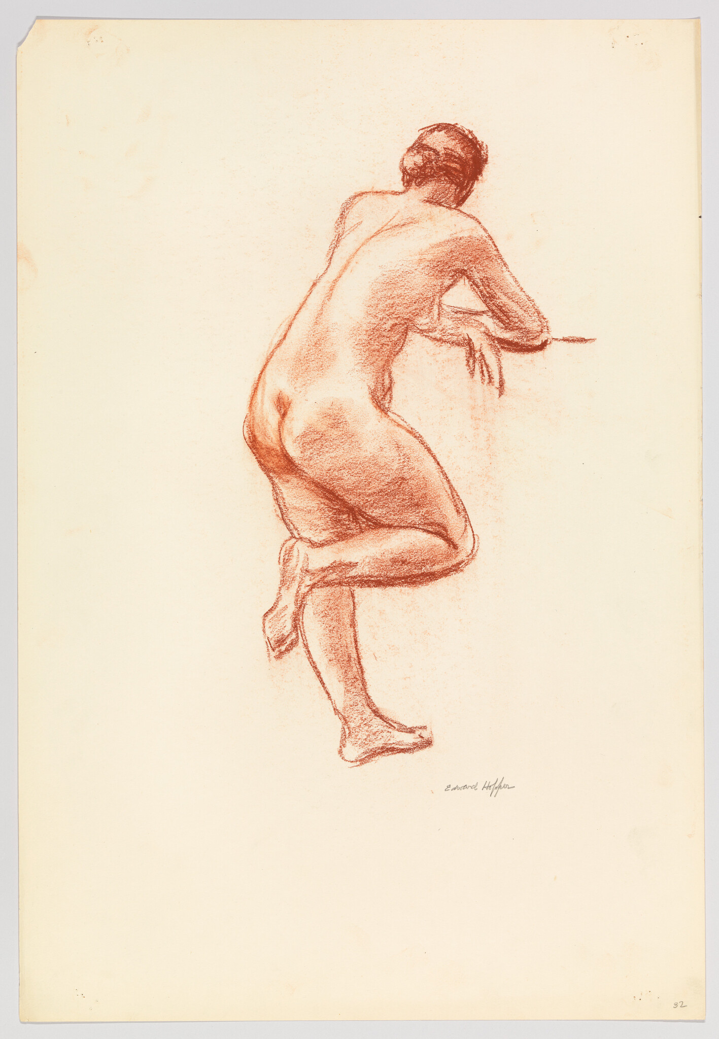 Nude figure drawn in red chalk leaning forward with arms resting and one leg raised.