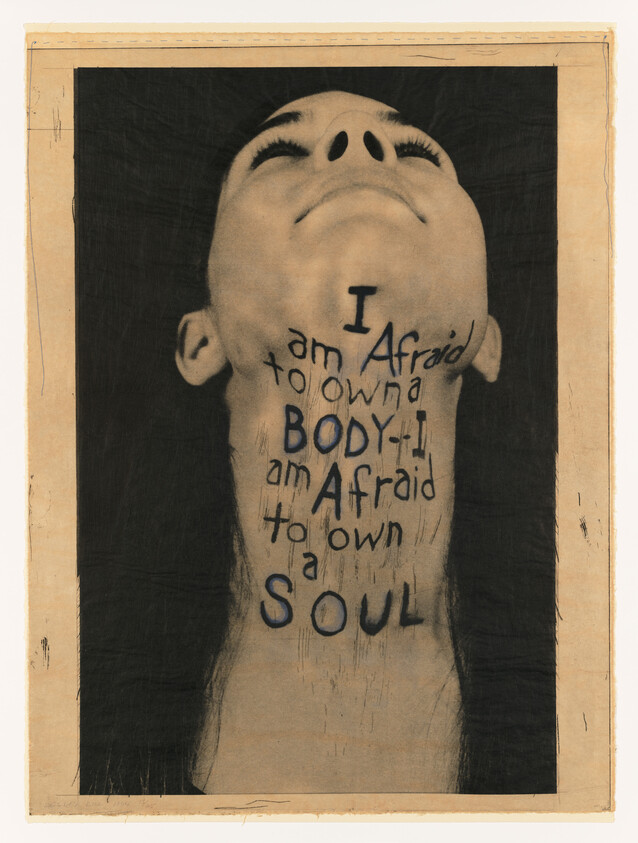 Person tilts head back with handwritten text on neck reading they are afraid to own body and soul.