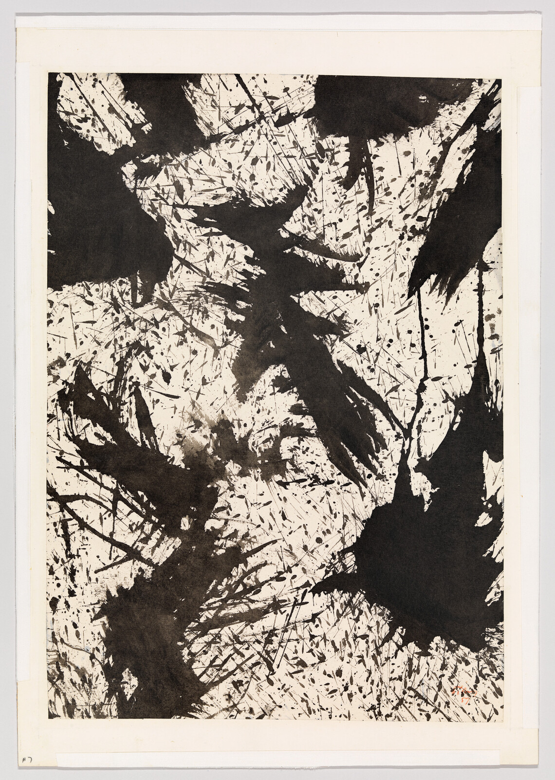 An abstract black and white artwork featuring dynamic splatters and brushstrokes creating a sense of movement and chaos on a paper canvas.