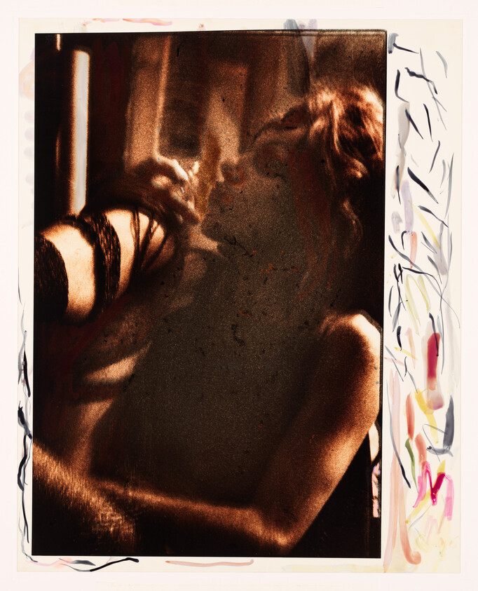 Two people in a dim, warm-toned embrace, their faces close as if about to kiss.