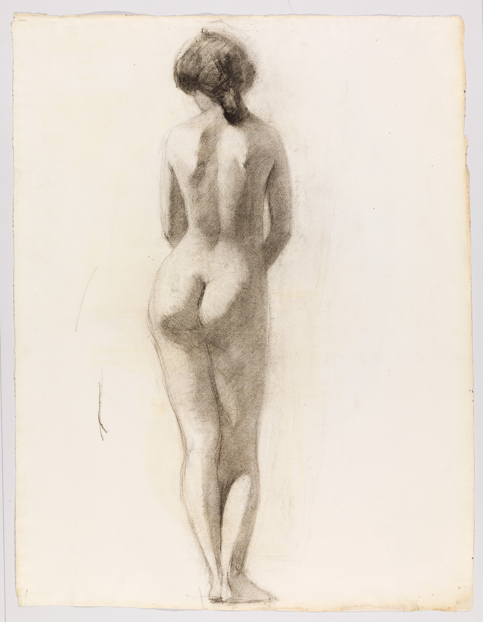 Nude woman standing with her back to the viewer in a soft charcoal sketch.