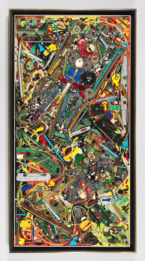 Tall colorful mixed-media collage of pinball machine parts and paint splatters in a black frame.