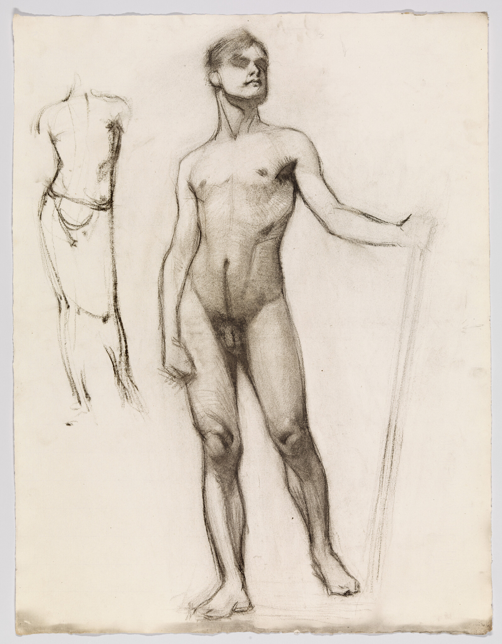 Young nude man stands holding a staff, posed in a classical figure drawing study.