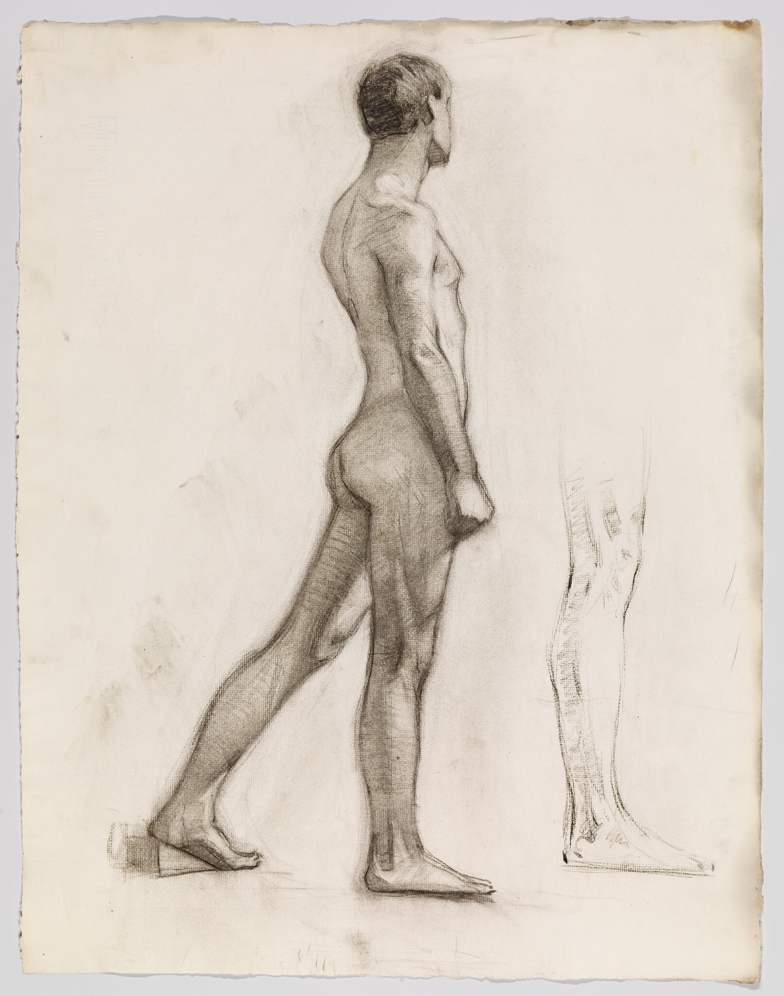 A charcoal study of a standing male nude seen in profile with a separate leg sketch.
