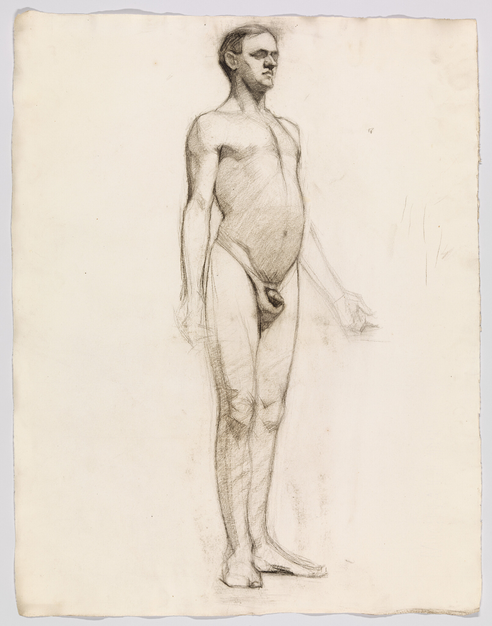 A standing nude man drawn in charcoal with relaxed arms and a neutral expression.