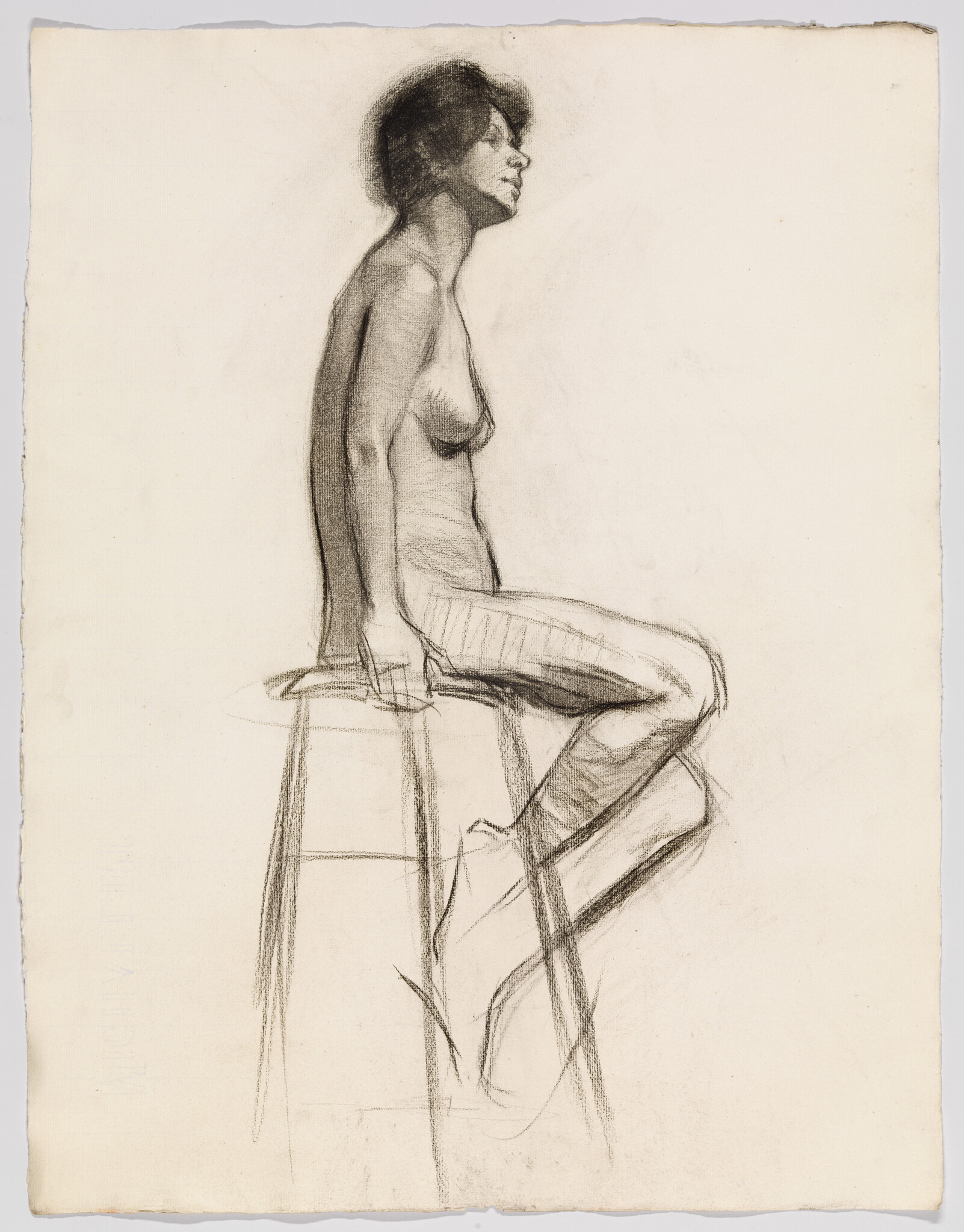 A nude woman sits sideways on a tall stool, hands resting on the seat, looking forward.