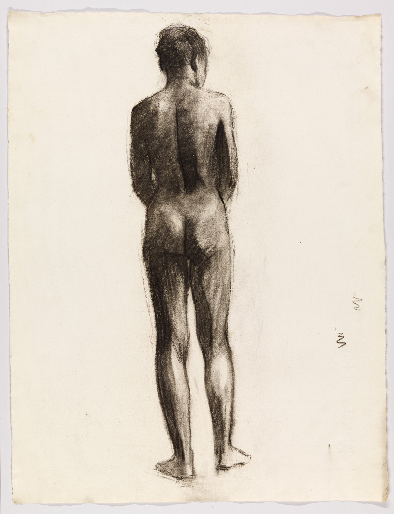 A standing nude figure seen from the back, drawn in charcoal with soft shading.