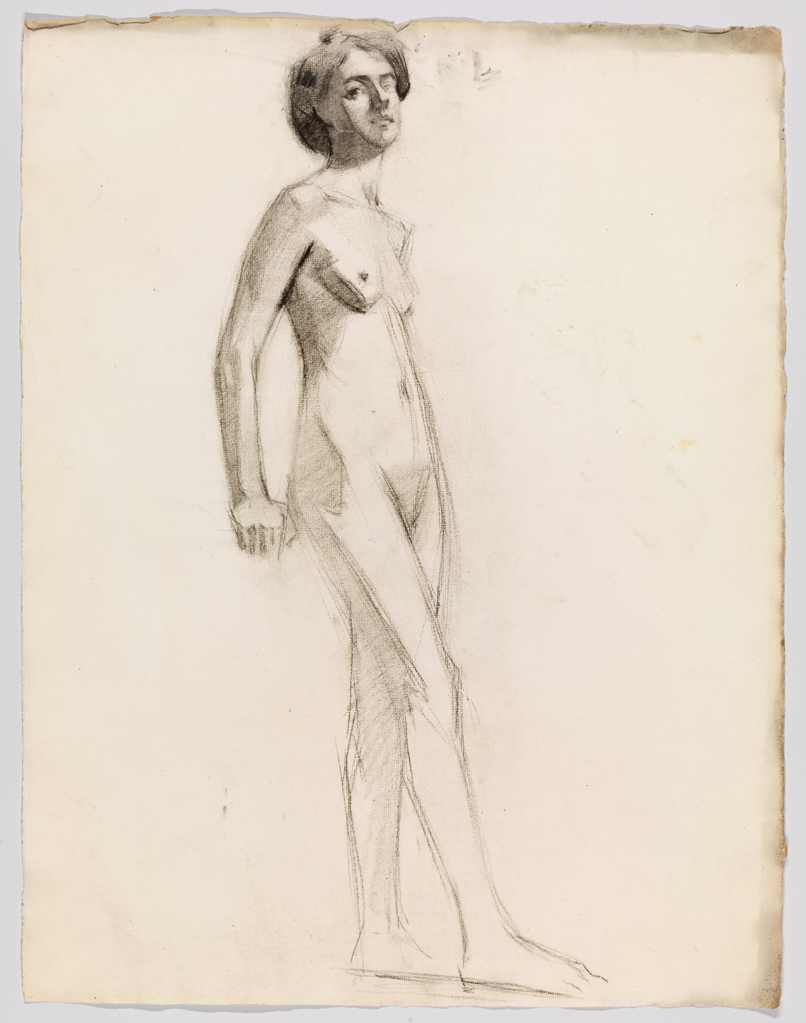 Nude standing woman sketched in charcoal with relaxed pose and soft contour lines.