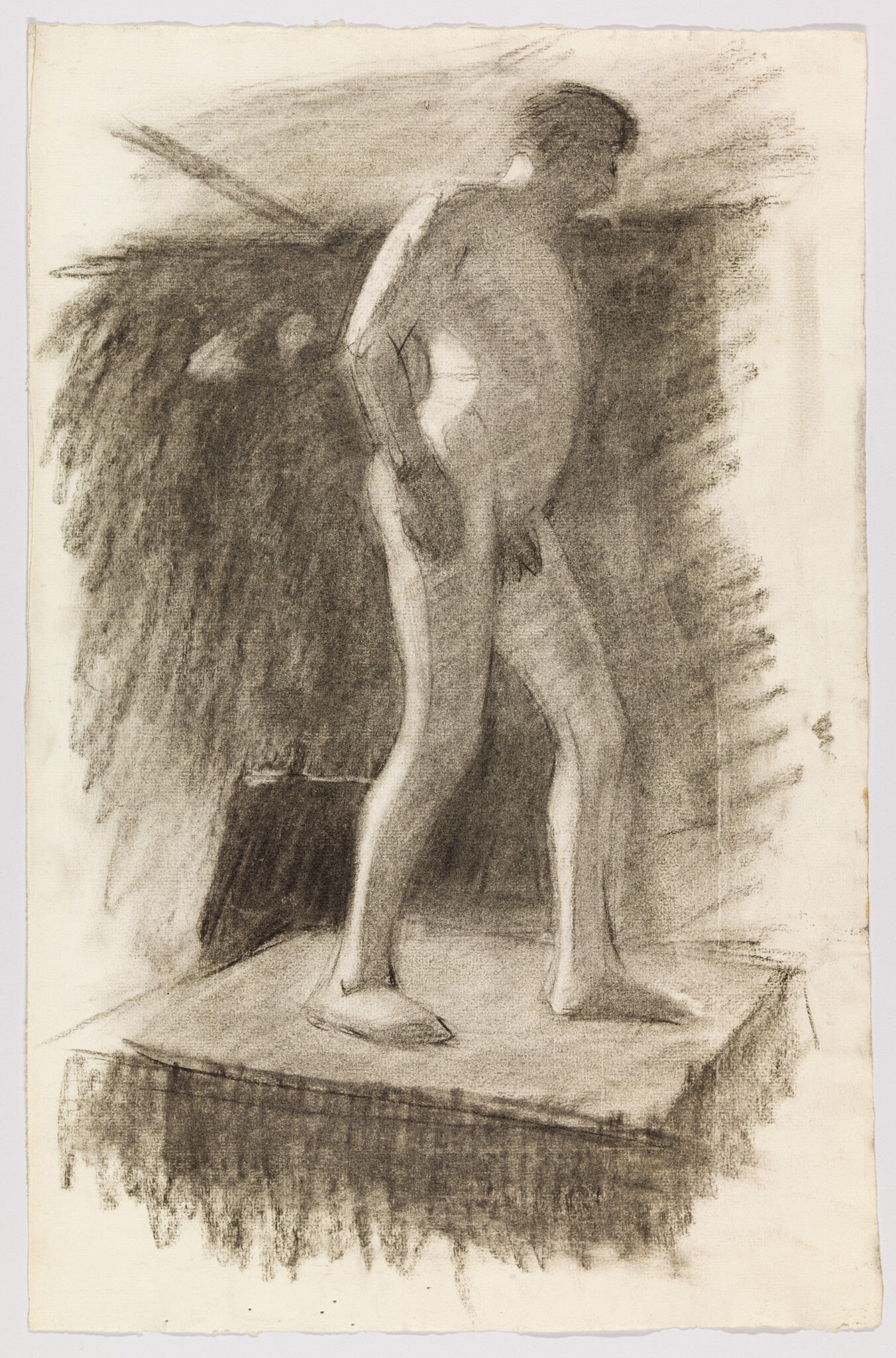 A charcoal study of a standing nude man on a raised platform with hands on hips.