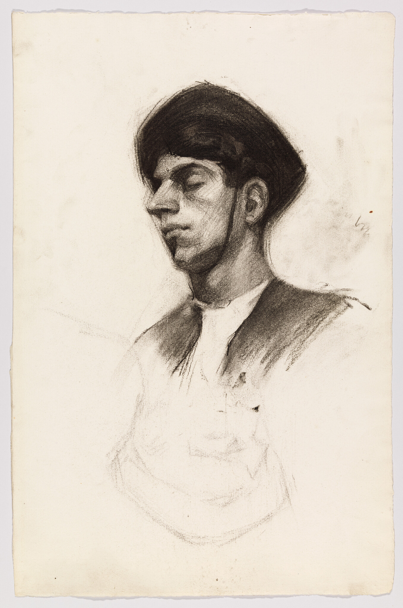 Young man wearing a dark cap with closed eyes, shown in a soft charcoal profile.