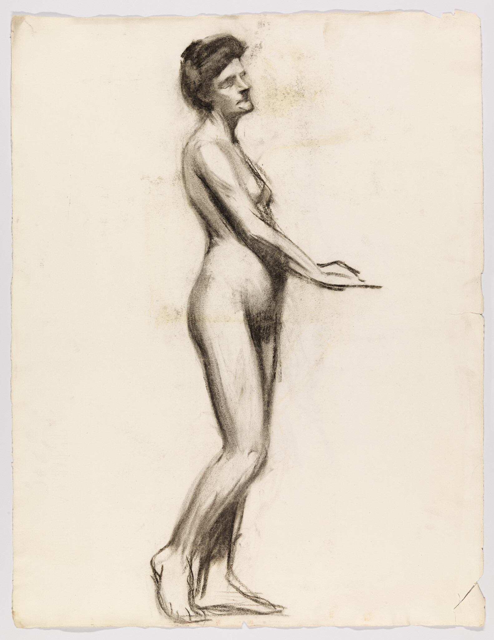 A standing nude woman drawn in charcoal, leaning forward slightly with arms extended and toes raised.