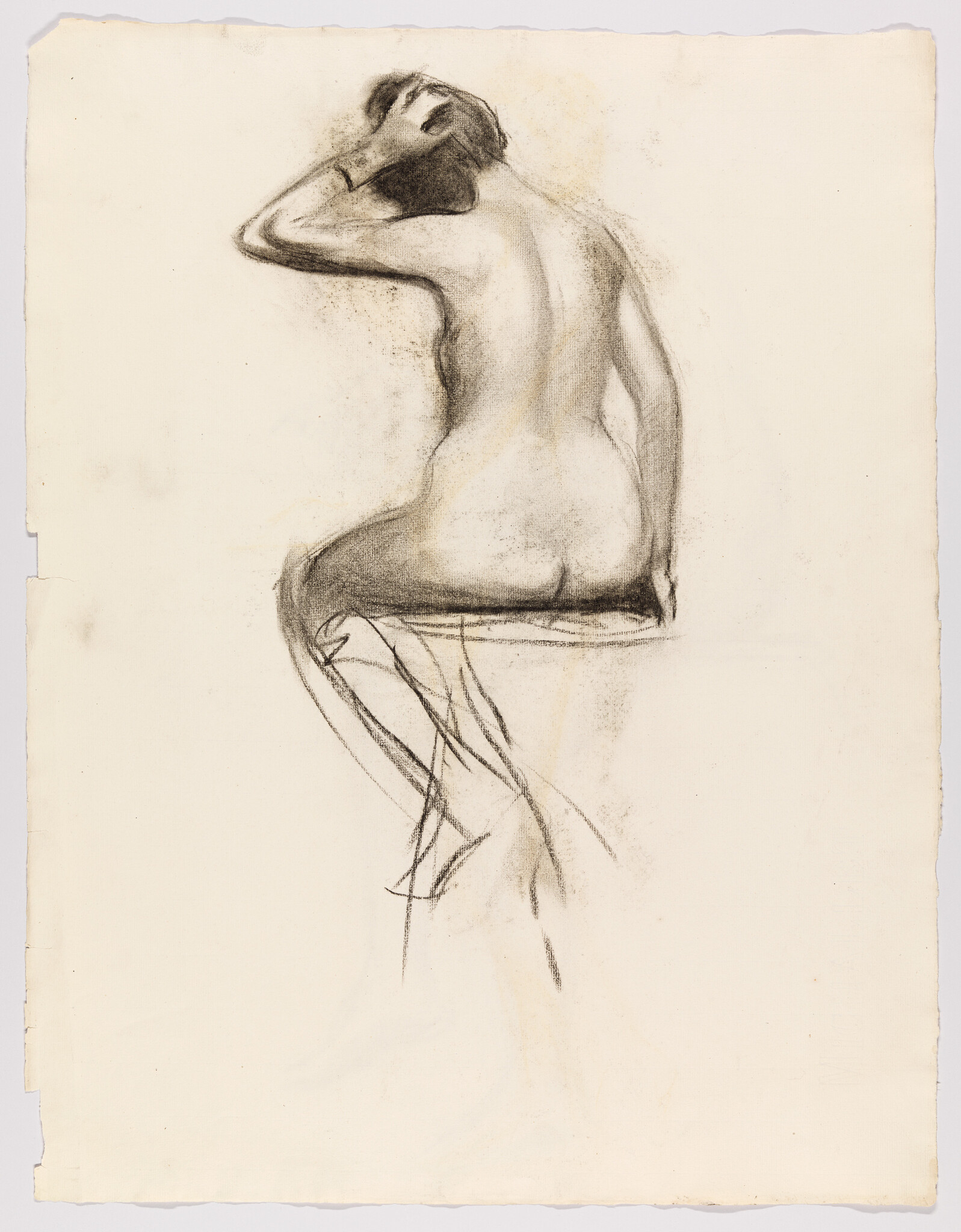 Seated nude figure drawn from the back, one hand on head, sketchy charcoal lines.