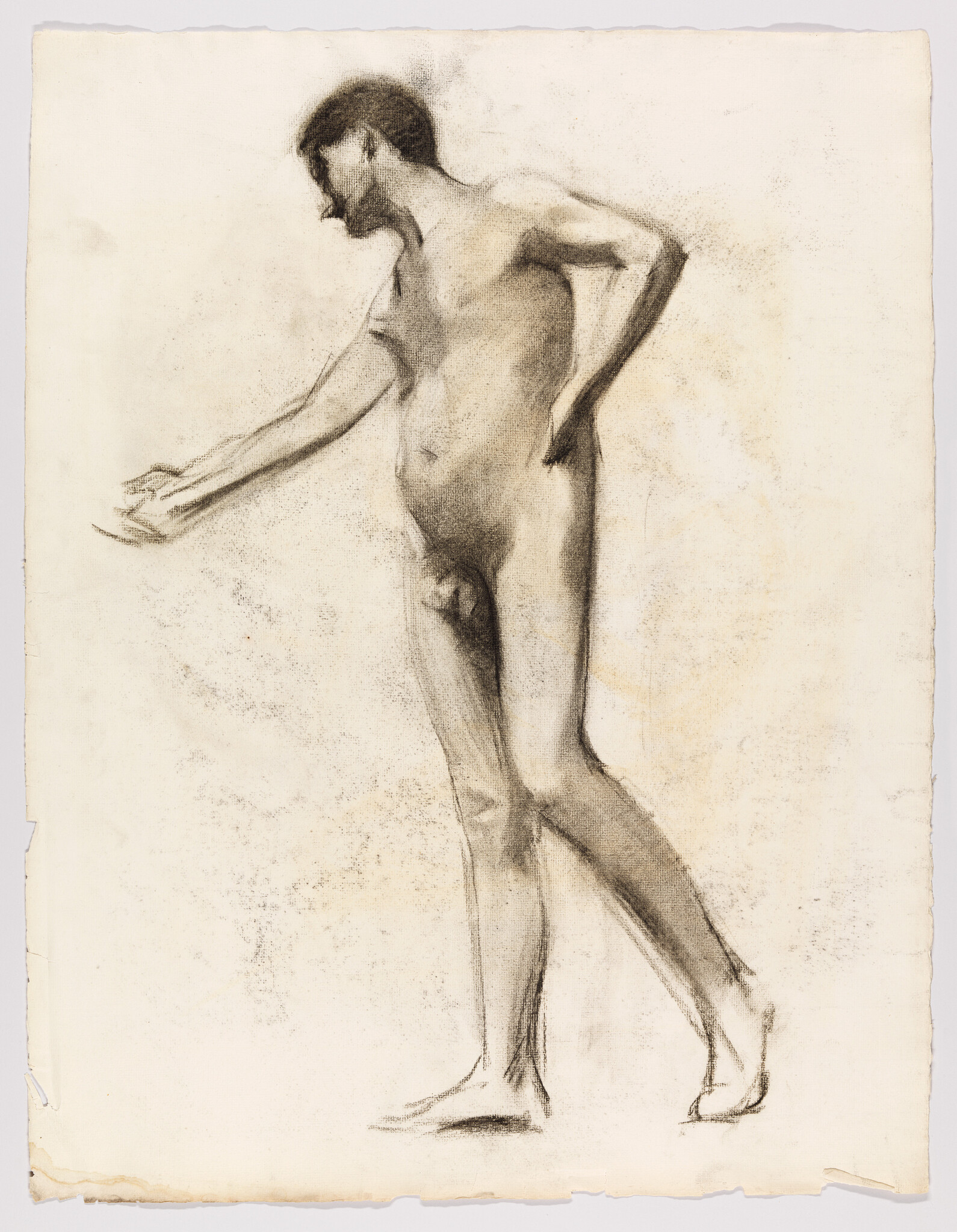 A charcoal sketch of a nude man standing with one arm extended and the other on his hip.