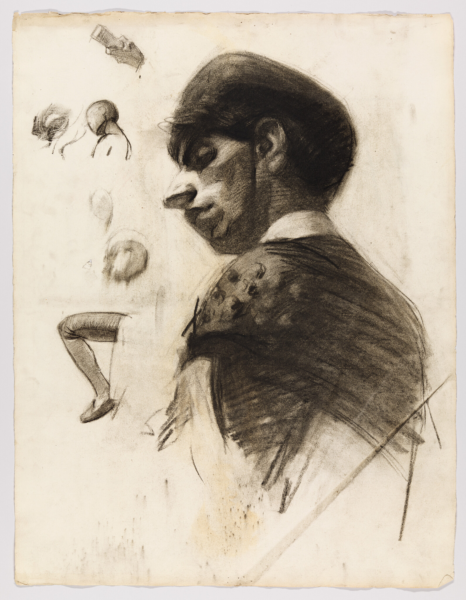 Young woman in profile sketched in charcoal with smaller studies of a head and leg nearby.