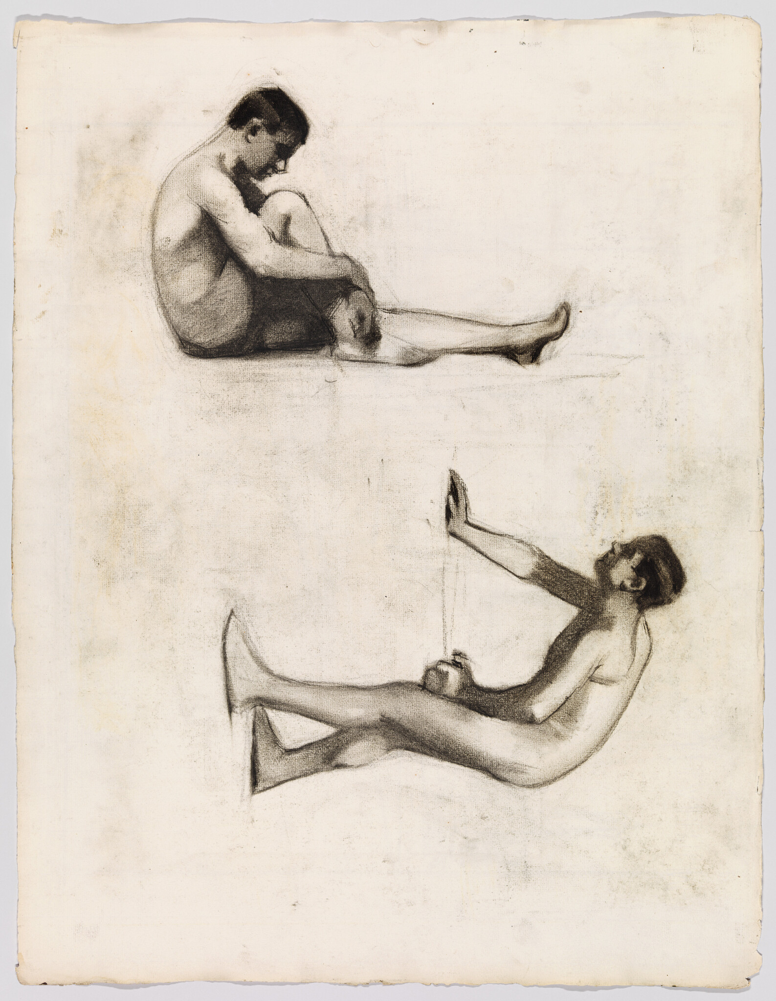Two charcoal figure studies showing a seated man holding his knees and a reclining man stretching an arm.