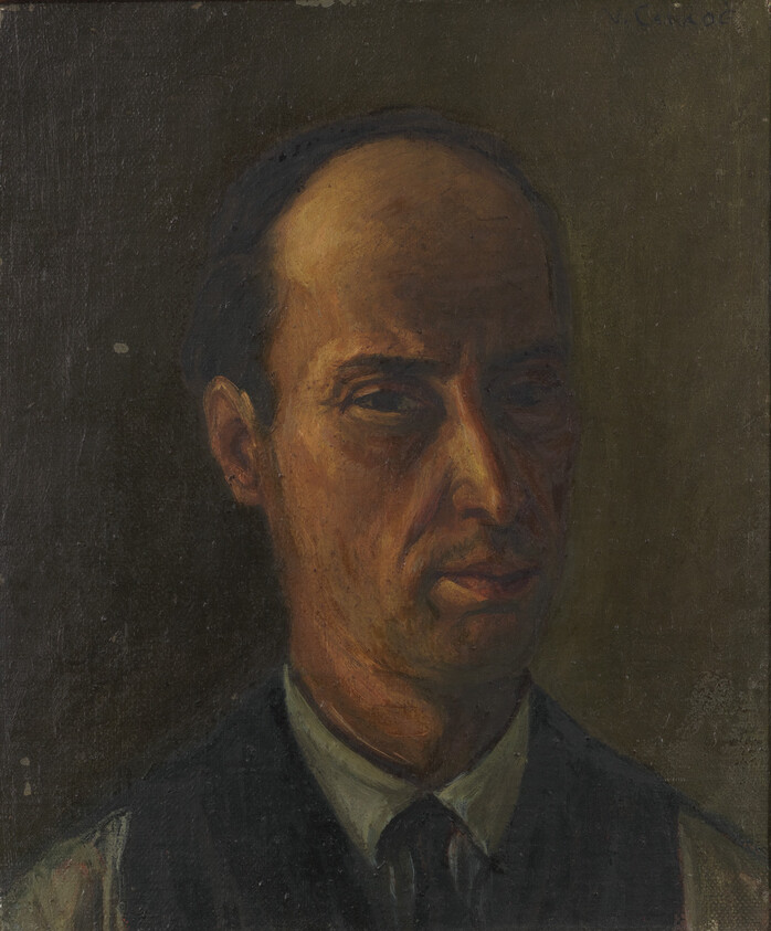 A middle-aged man with a serious expression wears a shirt and vest in dim, warm light.