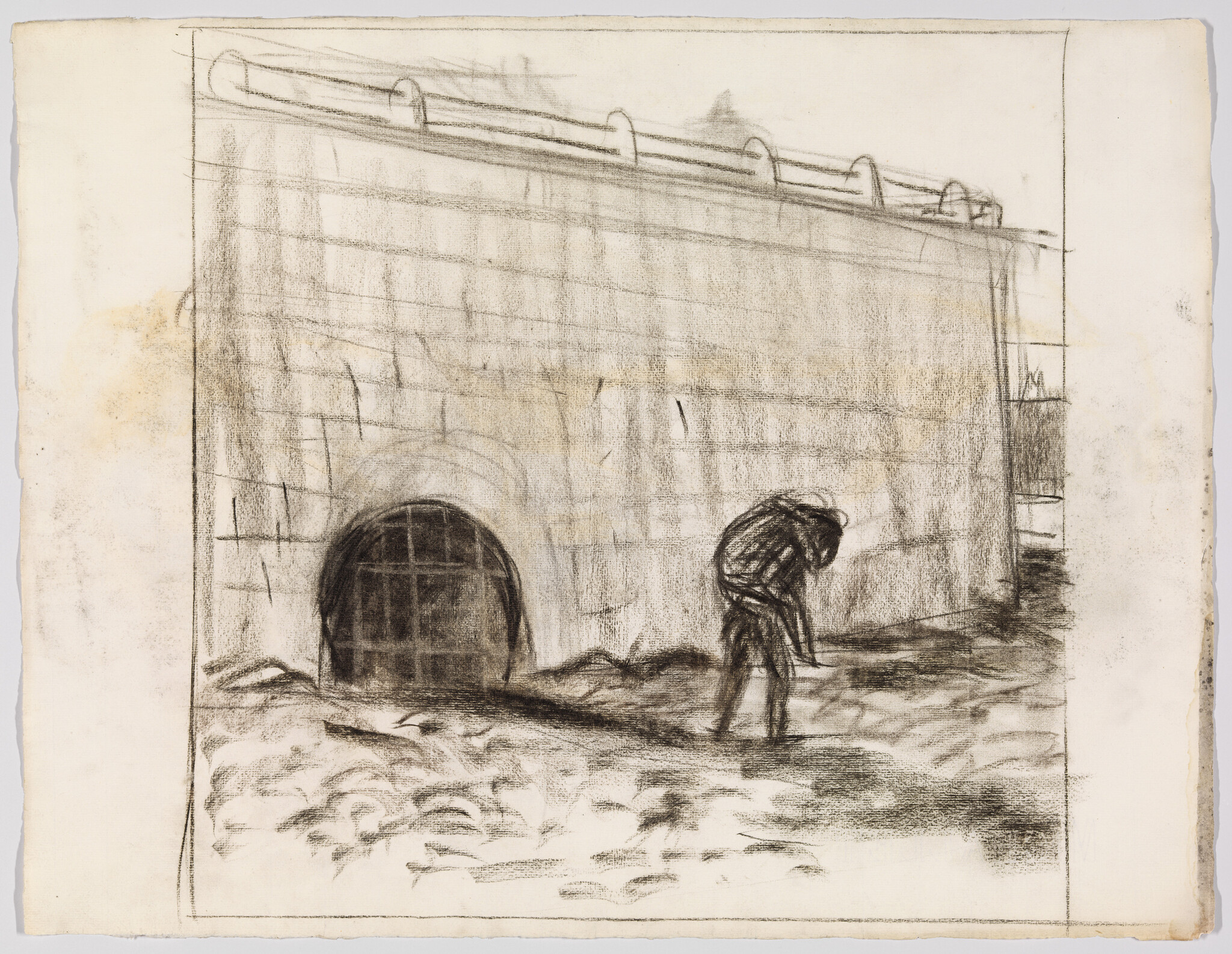 A hunched figure walks beside a large stone wall with a barred tunnel opening.
