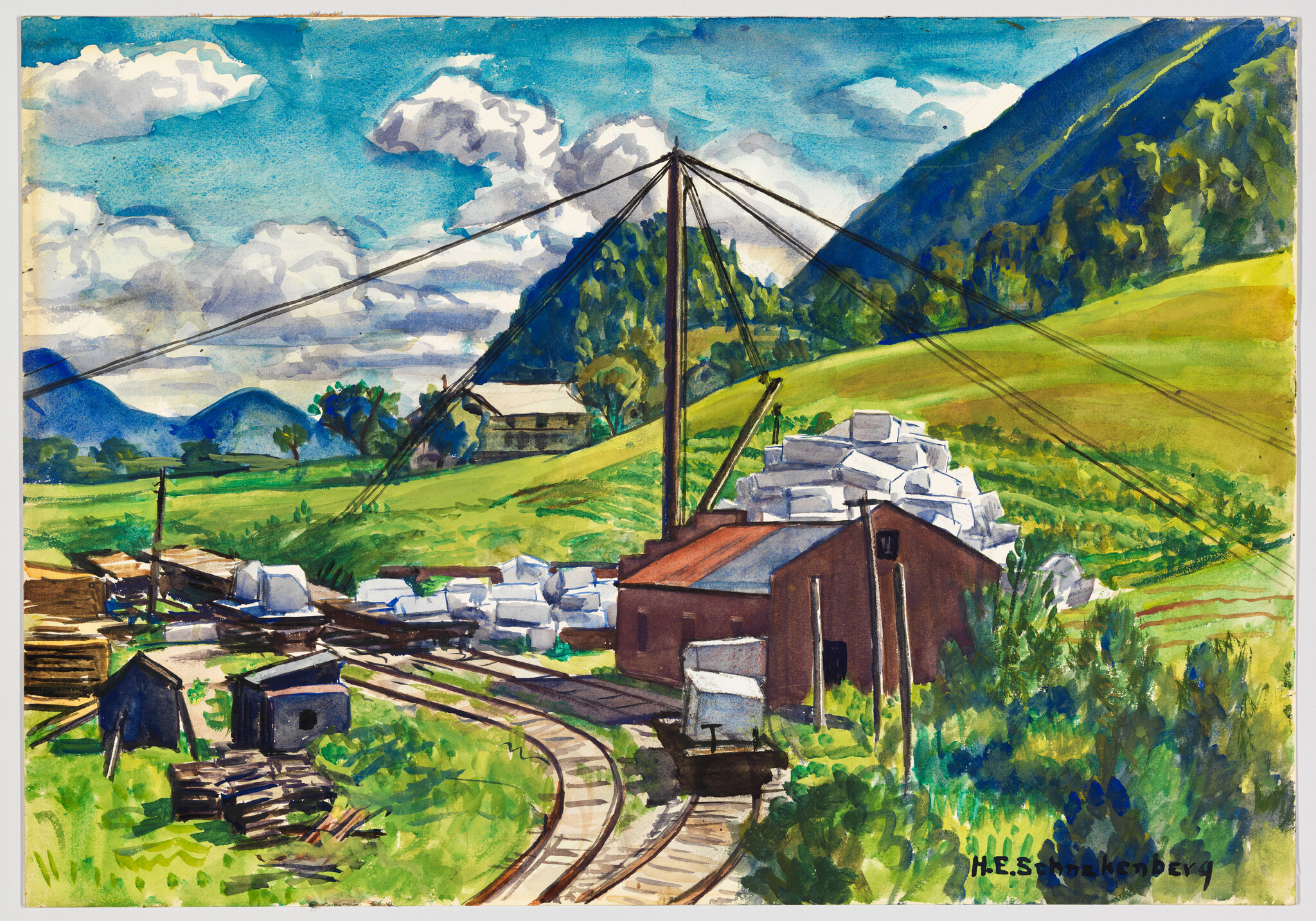 A small industrial yard with stacked white blocks, tracks curving past a red warehouse and crane.