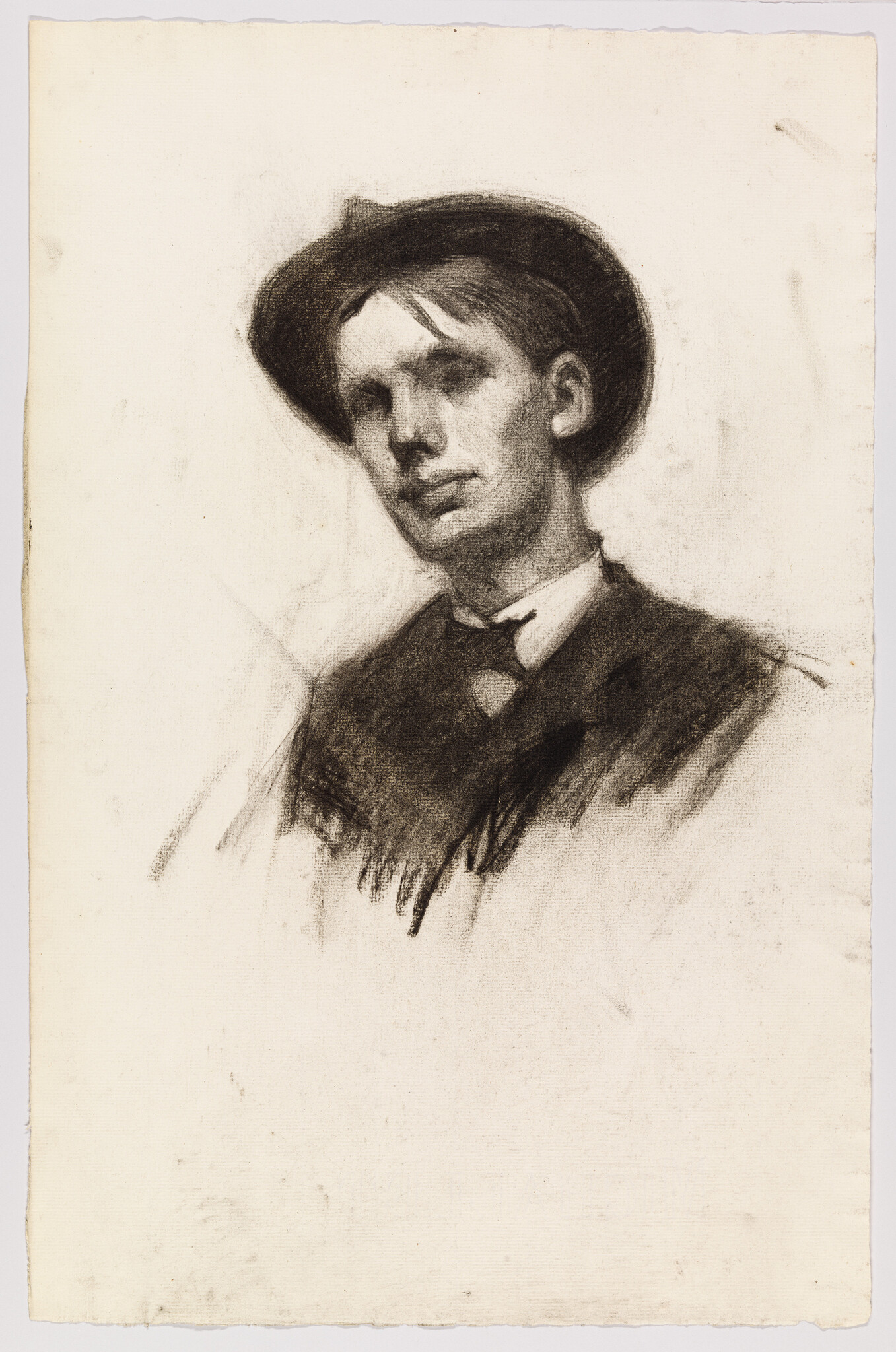 Young man in a hat and bow tie sketched in charcoal, looking slightly to the side.