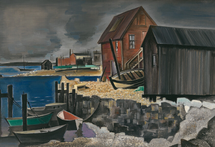 Weathered fishing boats tied at a rocky dock beside wooden shacks under a dark sky.