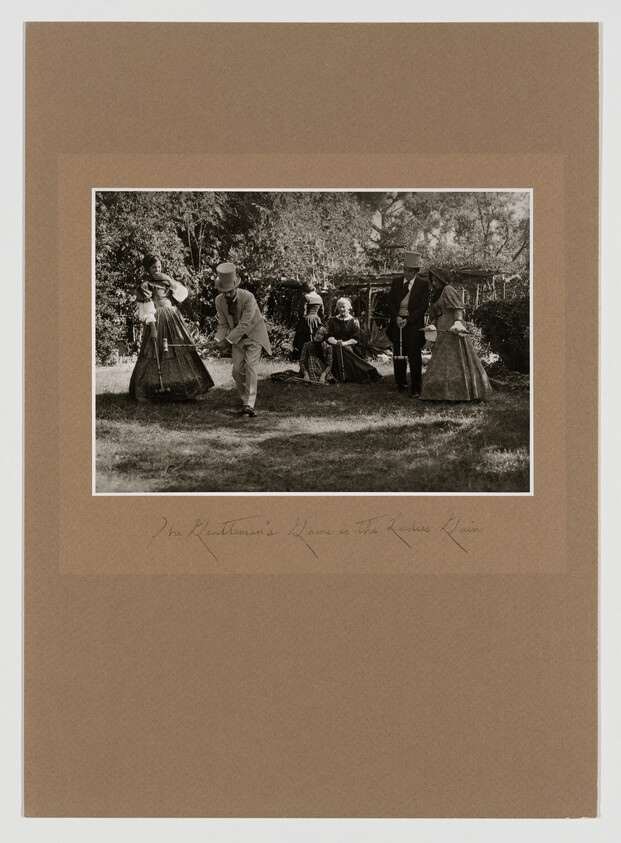 Victorian-dressed group playing croquet on a lawn while others watch under trees.