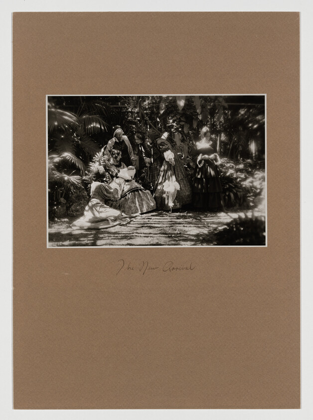 Several women in 19th-century dresses gather and converse in a shaded garden.