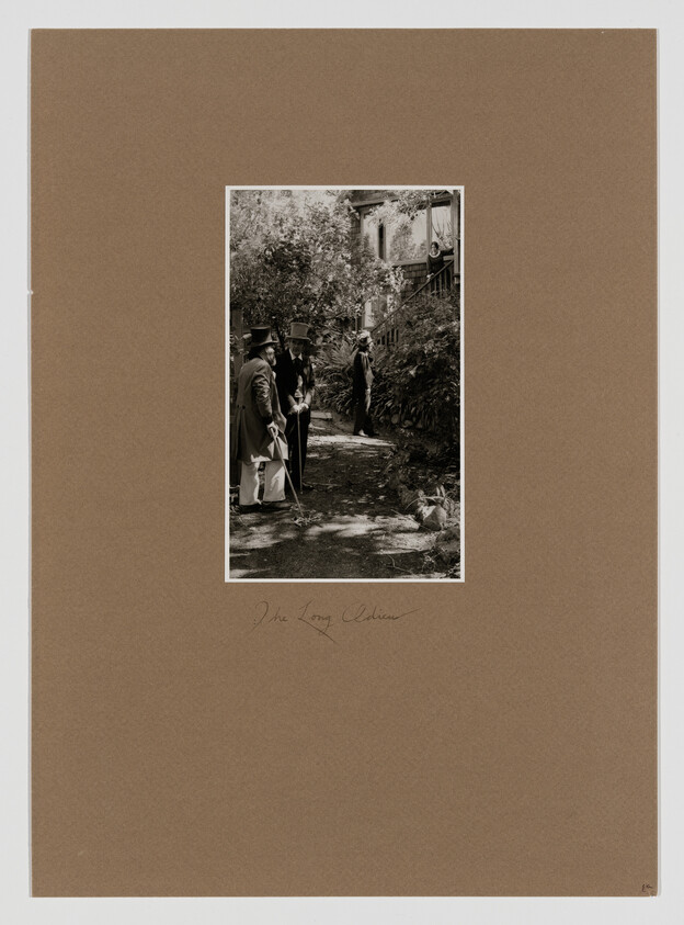 Three Victorian gentlemen in top hats stand and converse on a shaded garden path.
