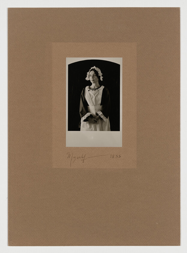 A woman in a maid's uniform stands with hands clasped, wearing a bonnet. The photo is mounted on brown paper with "Myself 1855" written below.