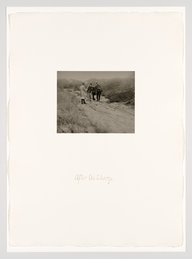 Four soldiers walk along a sandy path after a charge, with handwritten title "After the Charge."