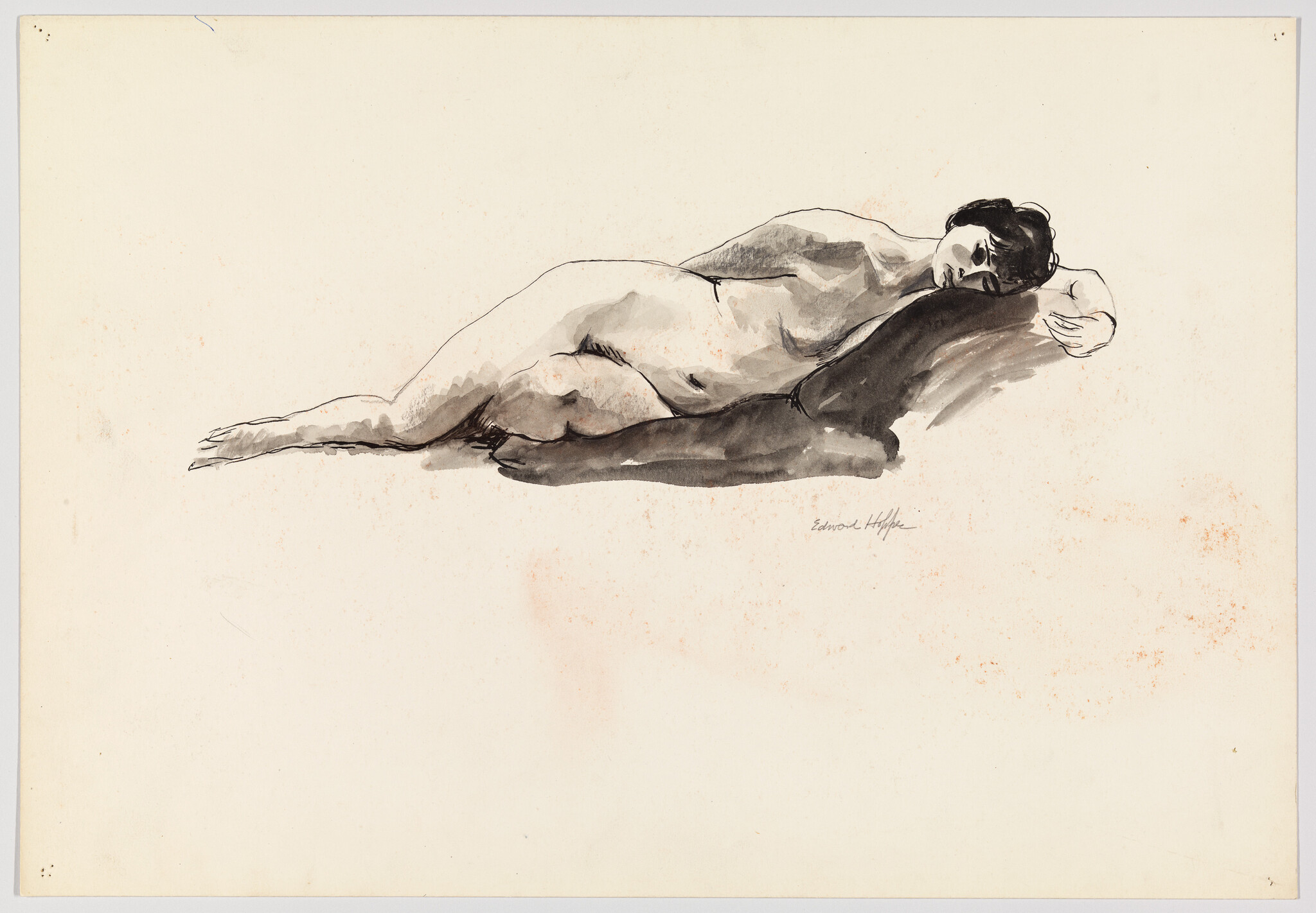 A nude woman lies on her side resting her head on a dark cushion.
