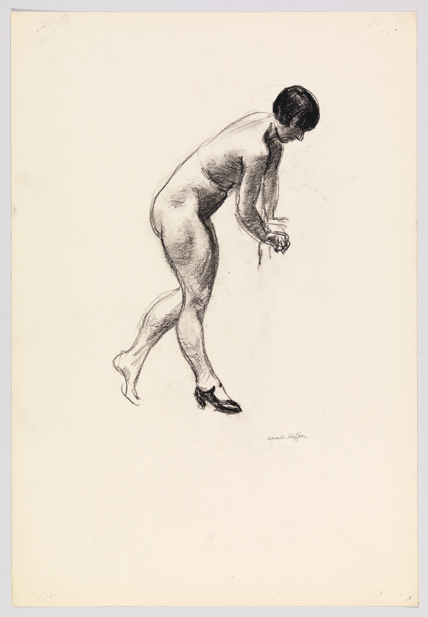 Nude woman bending forward, balancing on one foot while putting on a shoe.
