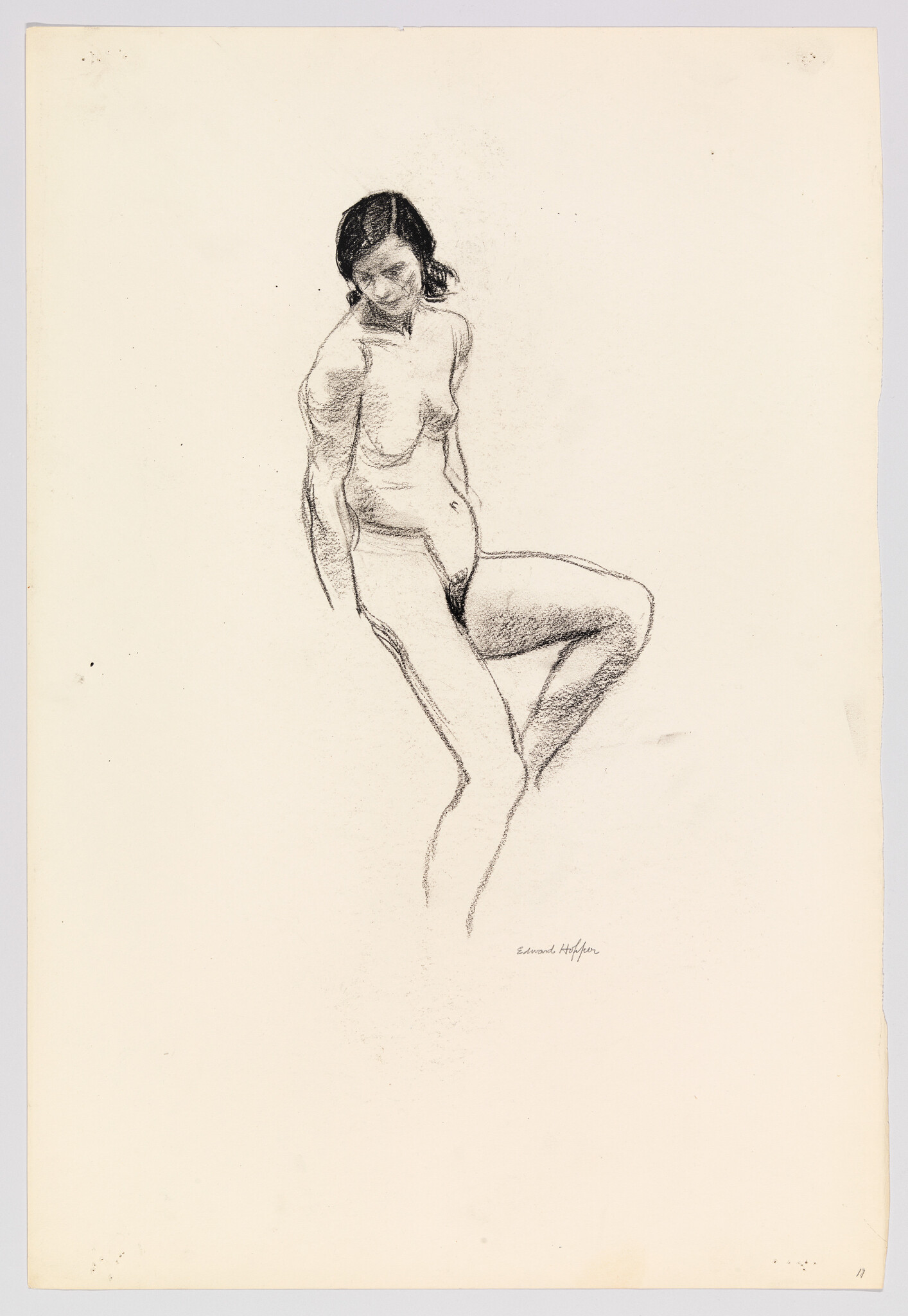 A charcoal sketch of a standing nude woman lifting one knee and looking downward.
