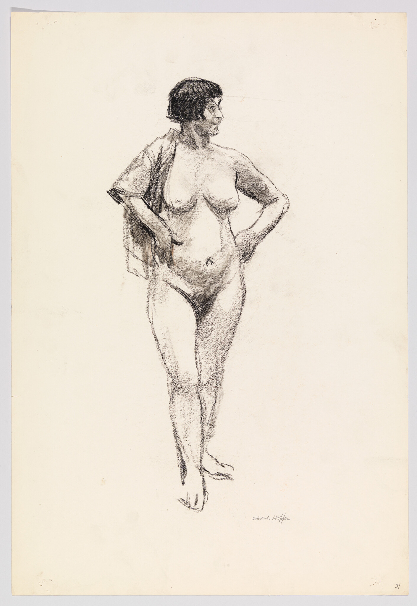 Nude woman with short hair stands with hands on hips looking to the right.