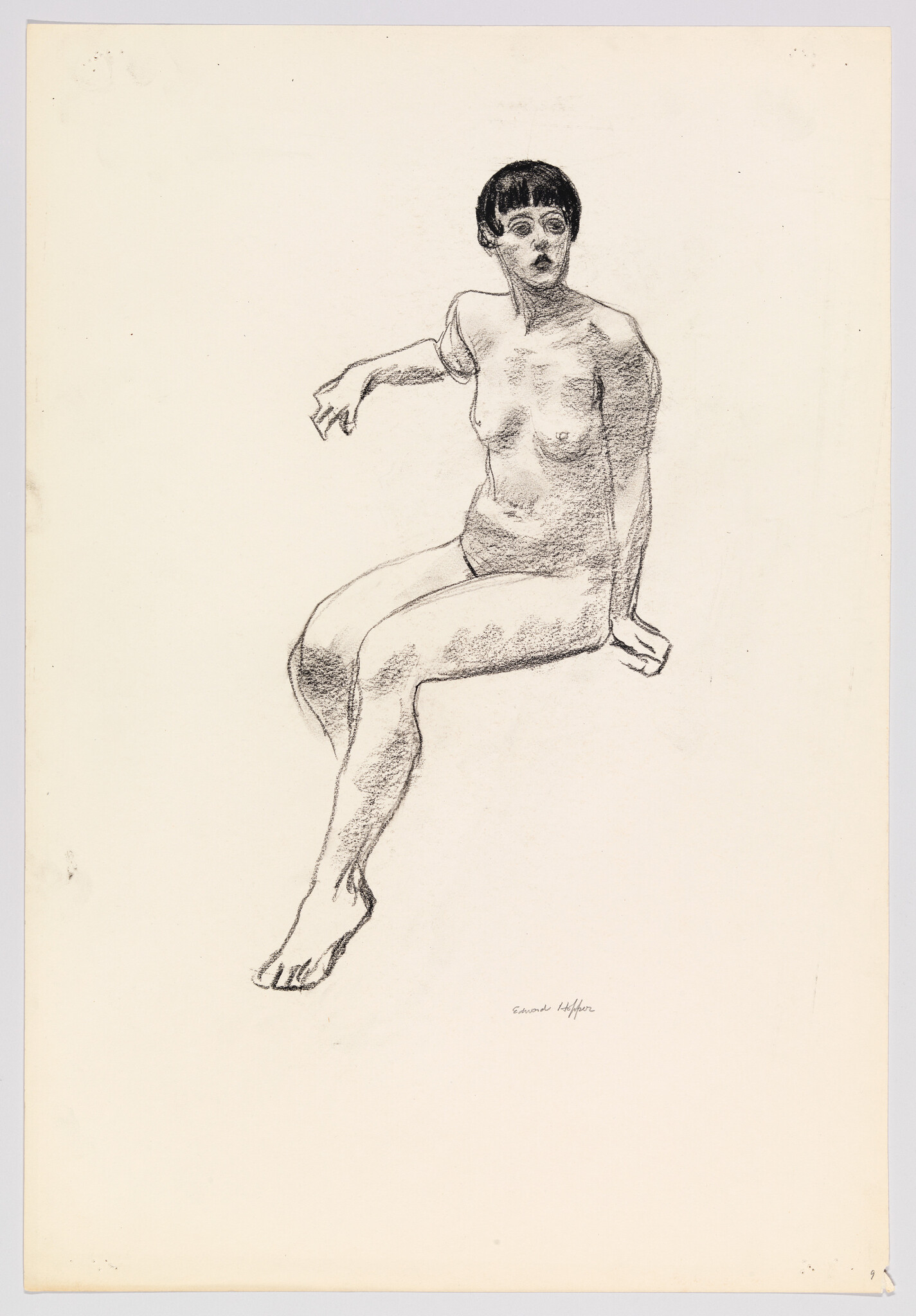 Seated nude woman with short hair reaching outward while resting one hand on a surface.