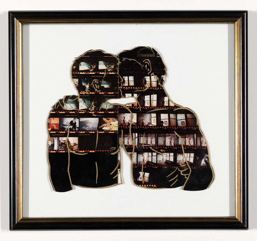 Two silhouetted figures embracing and kissing filled with filmstrip contact images in a black frame.
