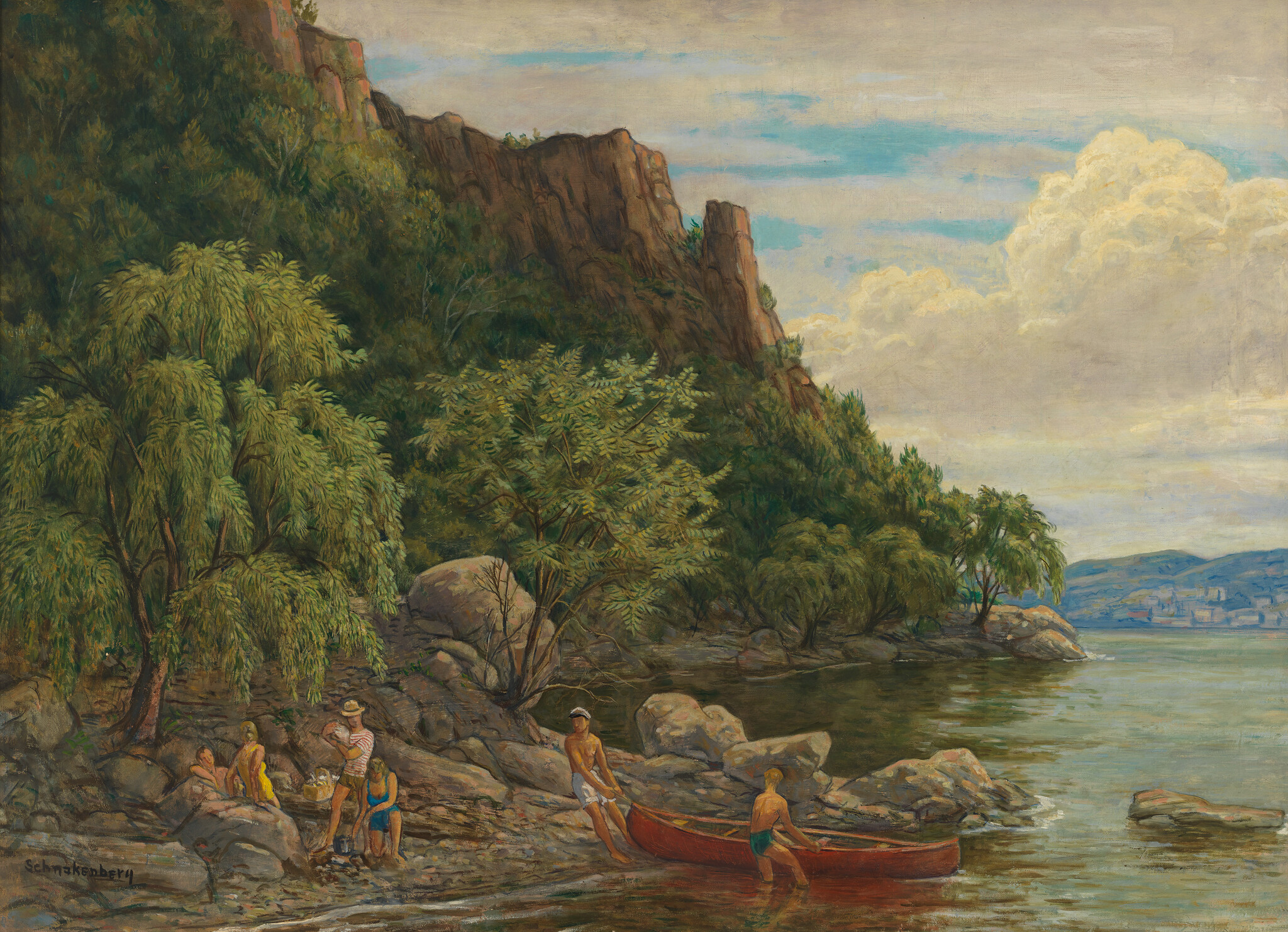 A group relaxes on a rocky shore while two men launch a red canoe into the lake.
