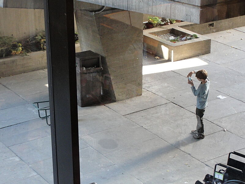 A child taking a photography outside
