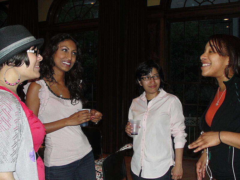 women smiling and having a conversation