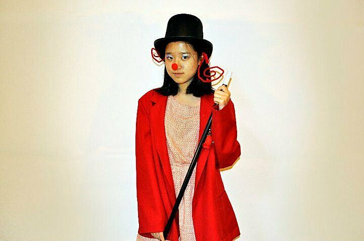 girl in red coat, nose and top hat