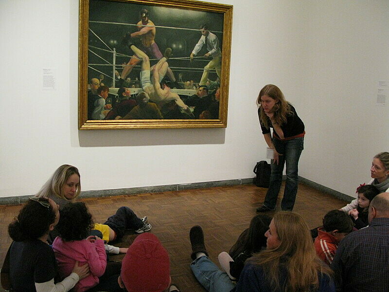 Kids listening to a talk in a gallery