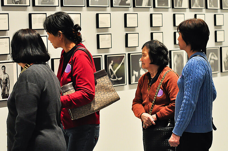 Senior citizens view an art exhibit