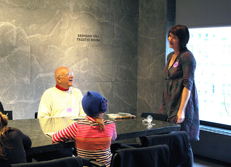 The artist talking to an adult and a child