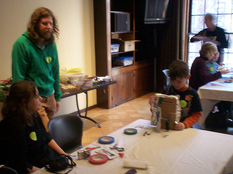 The artist interacts with children