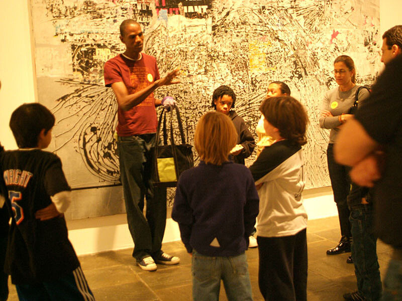 The artist talks about his art with families